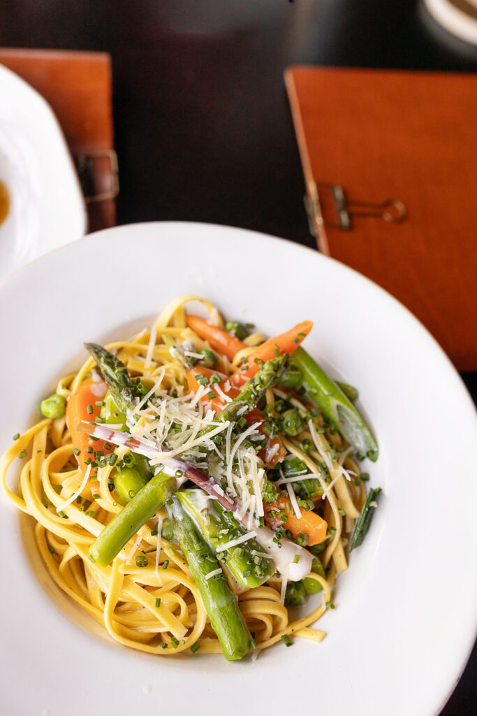 Best restaurants in Hendersonville, NC featuring seasonal brunch and dinner with farm-to-table dishes, buttermilk waffles, eggs, salads, steaks, pastas, burgers and craft cocktails.