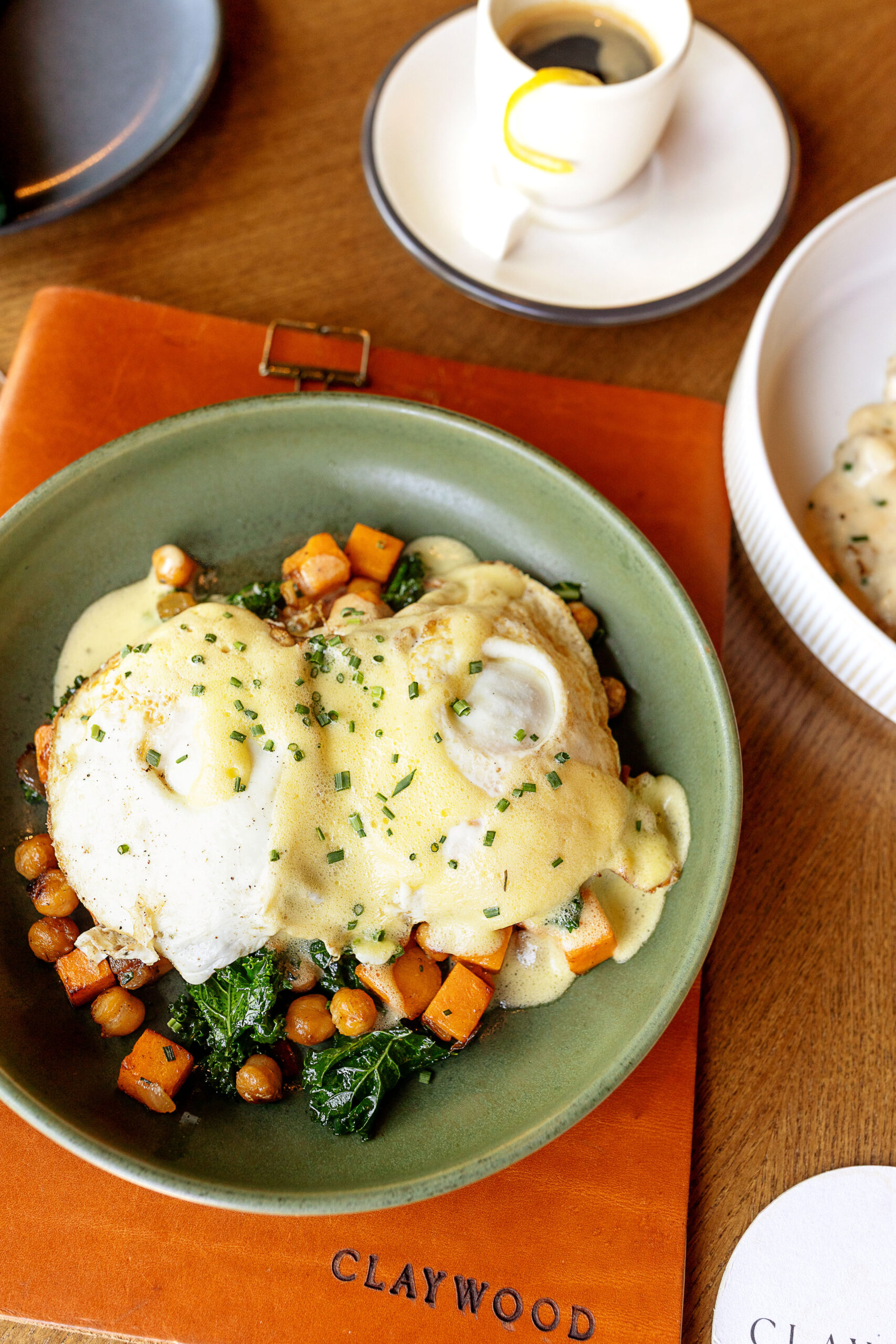 Best restaurants in Hendersonville, NC featuring seasonal brunch and dinner with farm-to-table dishes, buttermilk waffles, eggs, salads, steaks, pastas, burgers and craft cocktails.