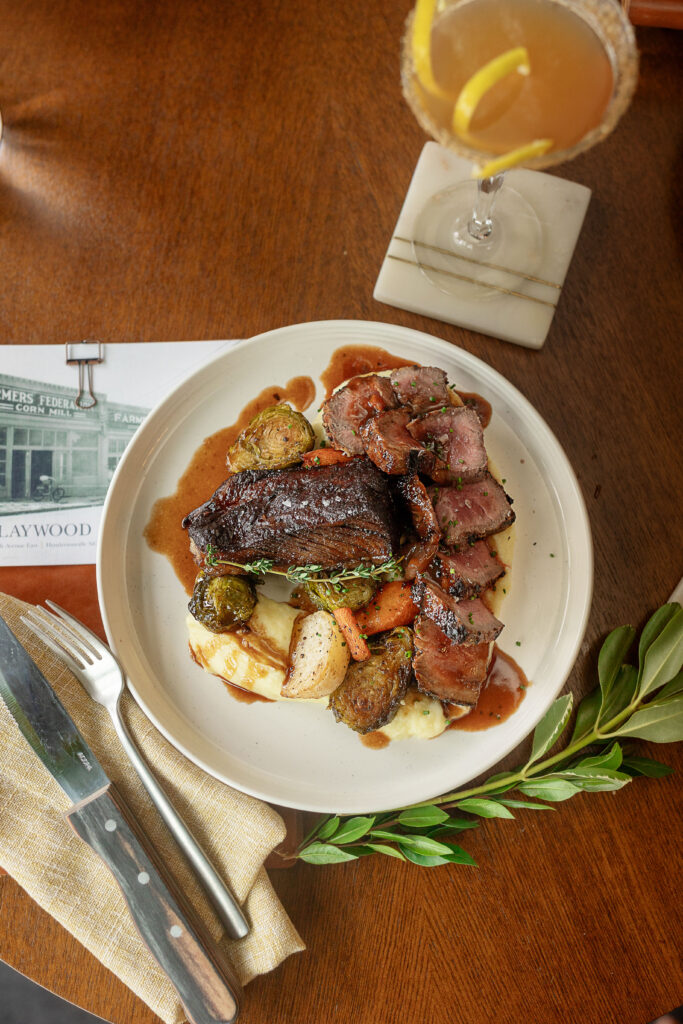 Best restaurants in Hendersonville, NC featuring dinner with farm-to-table dishes, salads, steaks, pastas, burgers and craft cocktails.