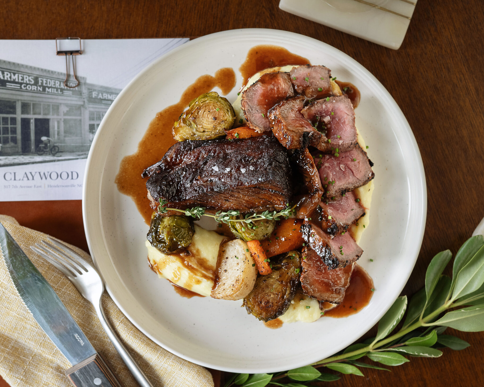 Best restaurants in Hendersonville, NC featuring dinner with farm-to-table dishes, salads, steaks, pastas, burgers and craft cocktails.